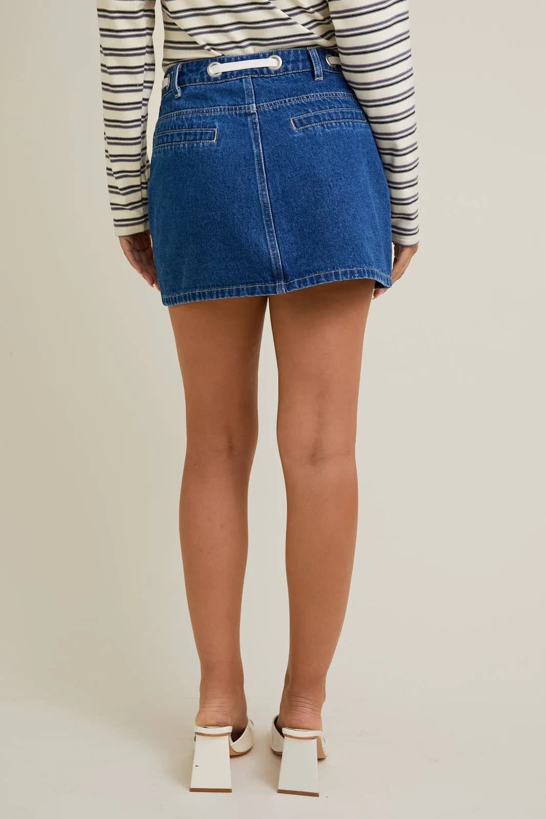 Denim Mid waist Eyelet Detail Tie Mini Skirt by Le Lis