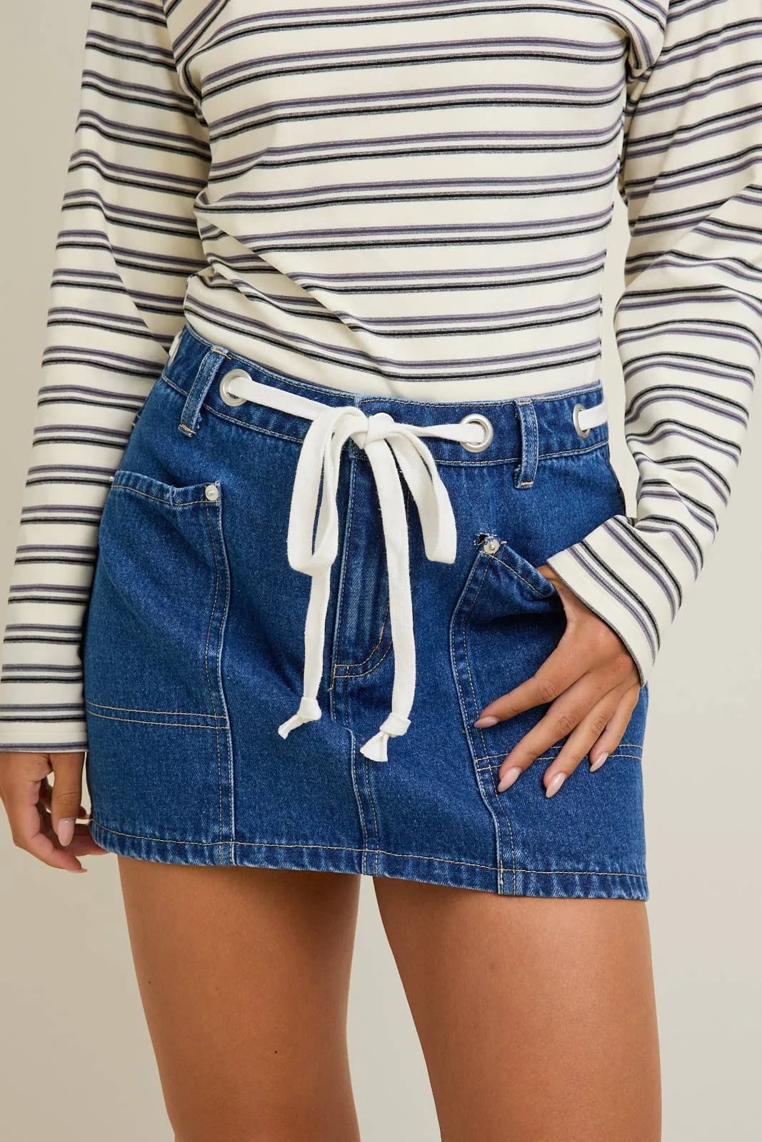 Denim Mid waist Eyelet Detail Tie Mini Skirt by Le Lis